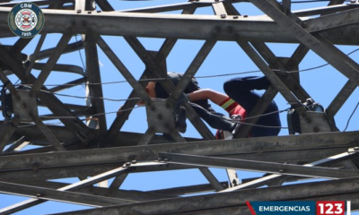 Guatemalan firefighters rescue man who drunkenly climbed an emblematic tower of the capital city